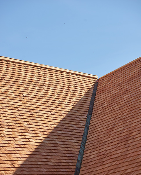 Blue tarp on storm-damaged roof